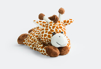 Giraffe plush toy isolated on white background with shadow reflection. Giraffe plush doll on white background. Colorful plush toy. Colored stuffed toy-giraffe. White brown giraffe