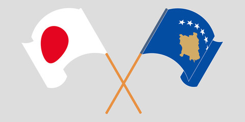 Crossed and waving flags of Kosovo and Japan