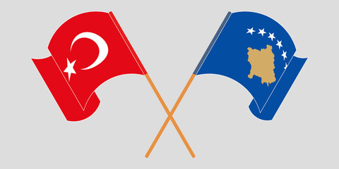 Crossed and waving flags of Kosovo and Turkey
