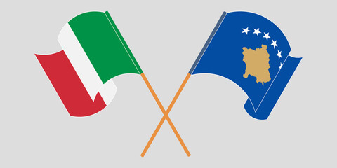 Crossed and waving flags of Kosovo and Italy