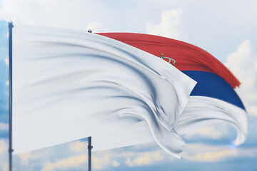 White flag on flagpole waving in the wind and flag of Serbia. Closeup view, 3D illustration.