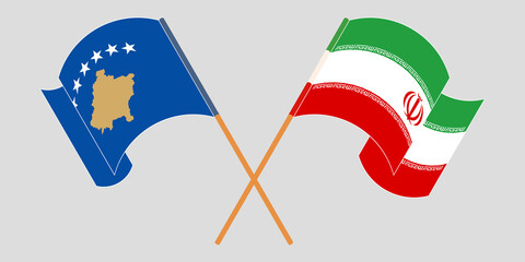 Crossed and waving flags of Kosovo and Iran