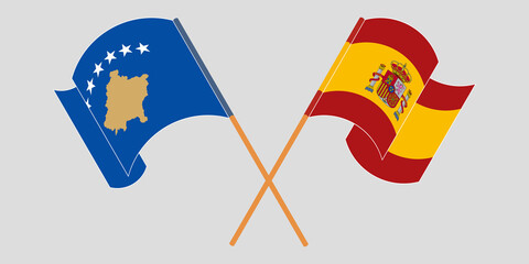 Crossed and waving flags of Kosovo and Spain