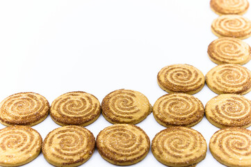 Round cookies. Curled cookies with sugar. Round cookies sprinkled with sugar.