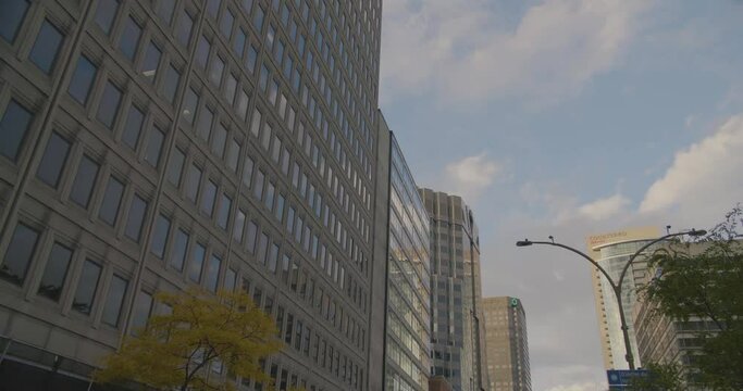 Montreal, Canada - April 15th 2017 : Zoom out shot of corporate headquarters concrete buildings, skyscrapers and towers, Rene Levesque Boulevard, Downtown.