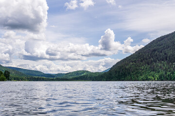 Paul Lake Summer time with green mountains and white clouds british columbia canada.