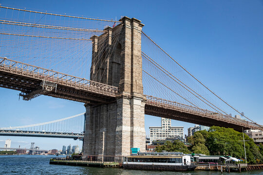 A view of the Brooklyn Bridge from the East River in New York City.