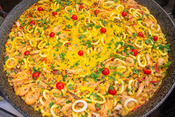 shellfish tentacles calamari shrimp and rice with lemon in wine