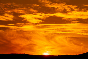 Swirling Yellow Clouds at Sunset, Sunrise over Horizon