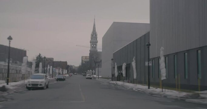 Montreal, QC, Canada - November 15 , 2017: Driving on Viger Avenue Est while passing by Alexandre DeSeve Street corner, with cloudy sky during winter.