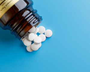 zinc tablets, nutrition supplement pills on blue background