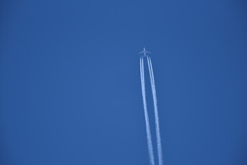 Jet airplane in the blue sky