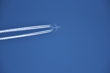 Jet airplane in the blue sky