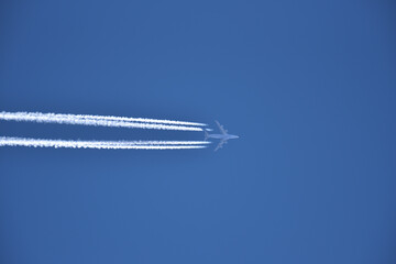 Jet airplane in the blue sky