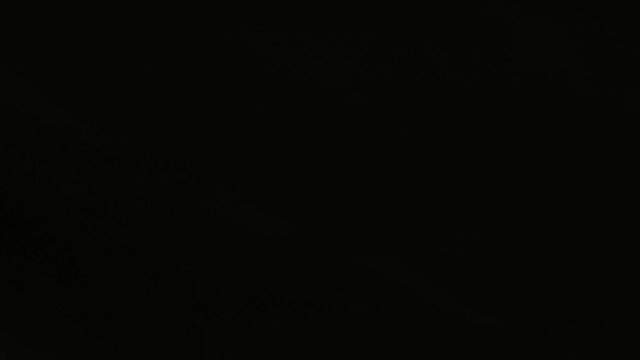 Montreal, QC, Canada - November 15, 2017 : lights moving on a dark background, filmed from the window of a subway train through an underground tunnel.