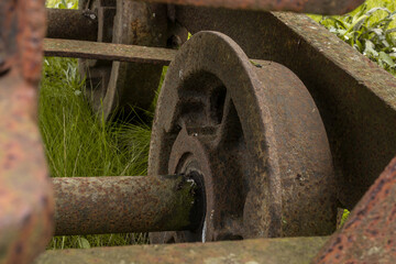 Detail of ore cart wheel on disused and abandoned ore cart in France.