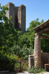 Summer garden scene with medieval ruins somewhere in Tuscany