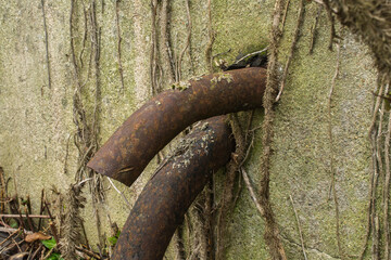 A waste pipe on an abandoned industrial building