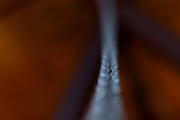 Metal chain on blurred background, defocused, motion effect - background concept.