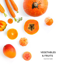 Creative layout made of orange vegetables and fruits. Flat lay. Food concept. Pumpkin,  papaya, orange, carrot, mango, guava, tangerine on the white background.