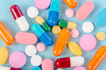Colored pills, tablets and capsules.