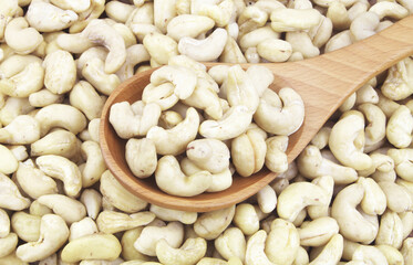 Cashew nuts with wooden spoon