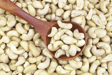 Cashew nuts with wooden spoon