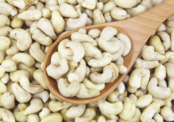 Cashew nuts with wooden spoon