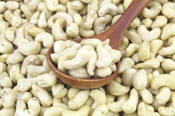 Cashew nuts with wooden spoon