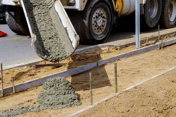 Construction process making of freshly poured cement sidewalk