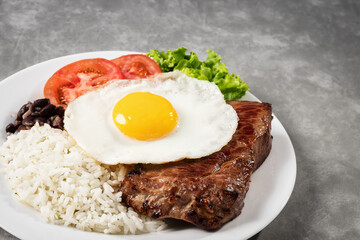 Steak dish with egg. Beef