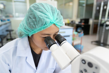 Picture of scientist using a microscope in a laboratory, Concept science and Technology,  Science background