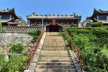 Fototapeta na wymiar Donggang City, Liaoning Province, China: August 18, 2019: Ancient Chinese temple buildings in Dagushan, Donggang City, Liaoning Province, China