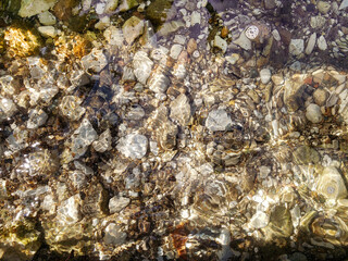 Beautiful crystal clear water and the rocks on the lake bed on Child's Lake in Duck Mountain Provincial Park, Manitoba, Canada