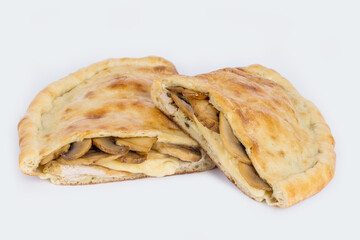Calzone cut on a white plate for tenderloin