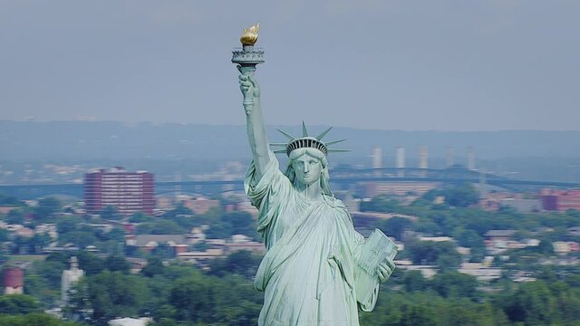 Rotating around Statue of Liberty revealing NYC skyline