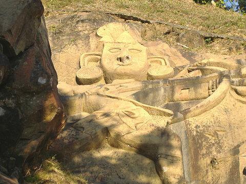 Ancient mysterious art sculptured on a stone wall at a disclosed location, Tripura, India.