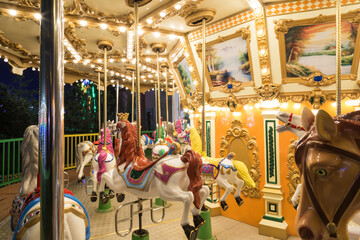 Fototapeta na wymiar A merry-go-round at an amusement park
