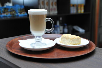 coffee, drink, cup, cafe, cappuccino, latte, beverage, glass, milk, hot, table, espresso, breakfast, brown, caffeine, white, mug, macchiato, cream, food, restaurant, mocha, chocolate, morning, saucer