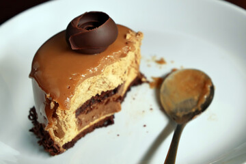 Glazed mini cake with chocolate desserts isolated on white plate.