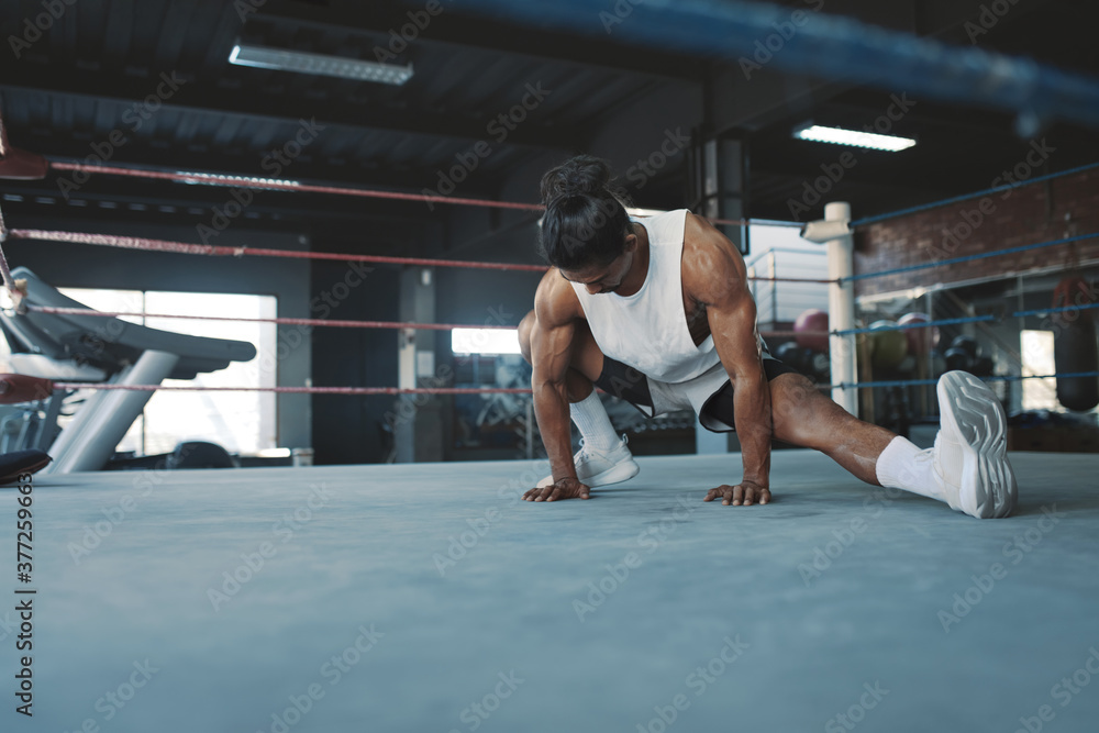 Sticker Workout. Man Stretching On Boxing Ring At Gym. Asian Sportsman Warming Up Before Intense Training. Bodybuilding For Strong, Healthy, Muscular Body. Sexy Guy Exercising At Fitness Center.