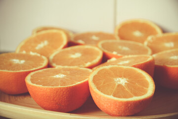 Bunch of fresh sliced oranges on a tray