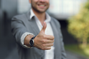 The man's hand shows the class, and points with his finger. The businessman clicks the button with...