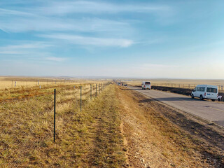 Straight road in desert with blue sky in Danjilin desert Inner Mongolia. Classic panorama view of an endless straight road running through the barren scenery desert.