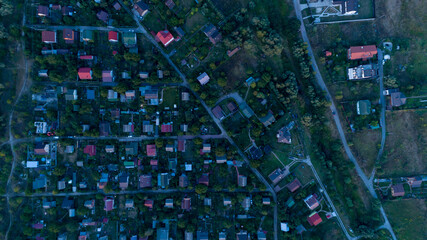 Top view of the village with private houses at sunset. Aerial view.