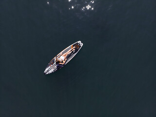 Attractive Woman on Stand Up Paddle Board, Woman paddling on sup board and enjoying turquoise...