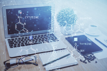 Desktop computer background and DNA drawing. Double exposure. Science concept.