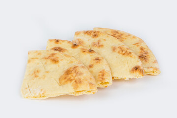 Triangular slices of pita bread shot on a white background