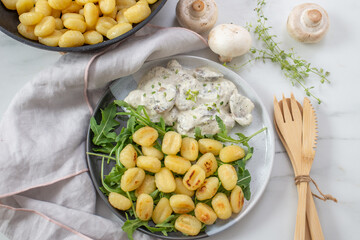 home made gnocchi with mushrooms and arugula salad