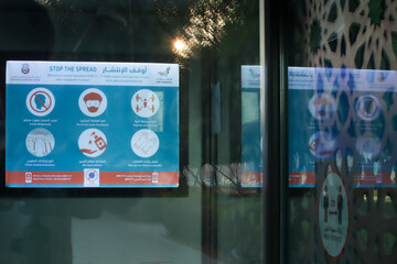 Signs and Symboles for social distancing in Abu Dhabi bus station.